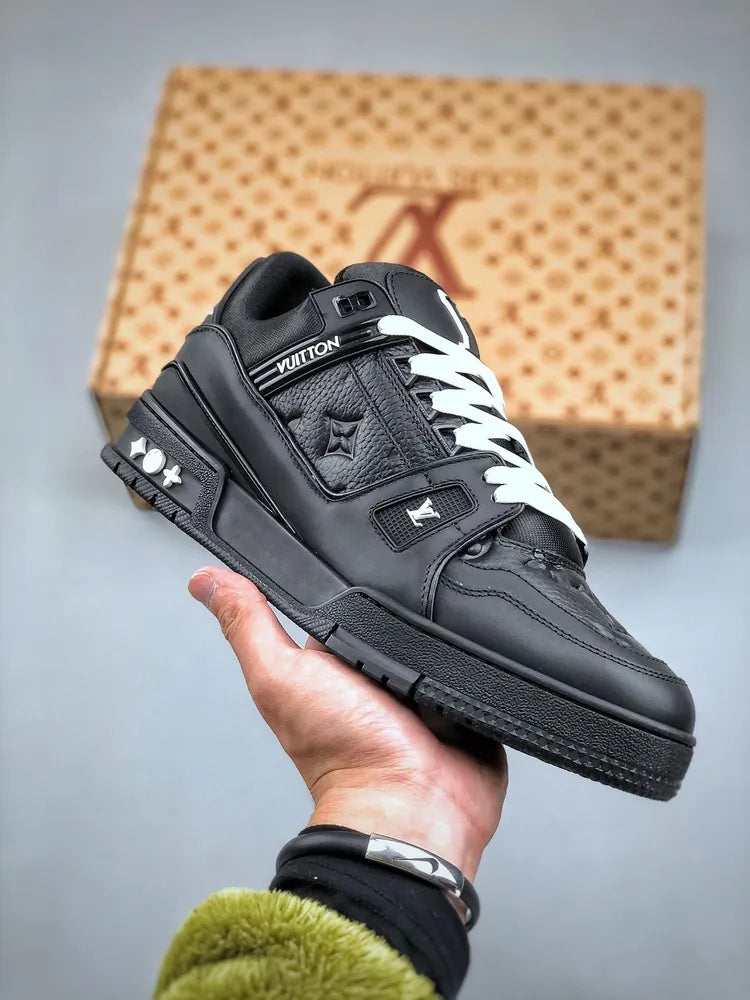 https://cdn.shopify.com/s/files/1/0648/4253/0893/files/LouisVuittonBlackTrainer_1.webp?v=1762887084
