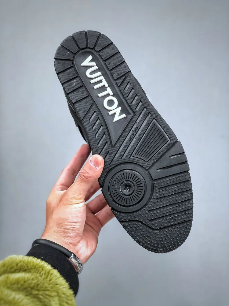 https://cdn.shopify.com/s/files/1/0648/4253/0893/files/LouisVuittonBlackTrainer_2.webp?v=1762887084