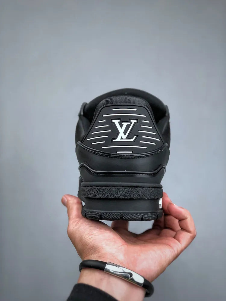 https://cdn.shopify.com/s/files/1/0648/4253/0893/files/LouisVuittonBlackTrainer_3.webp?v=1762887084