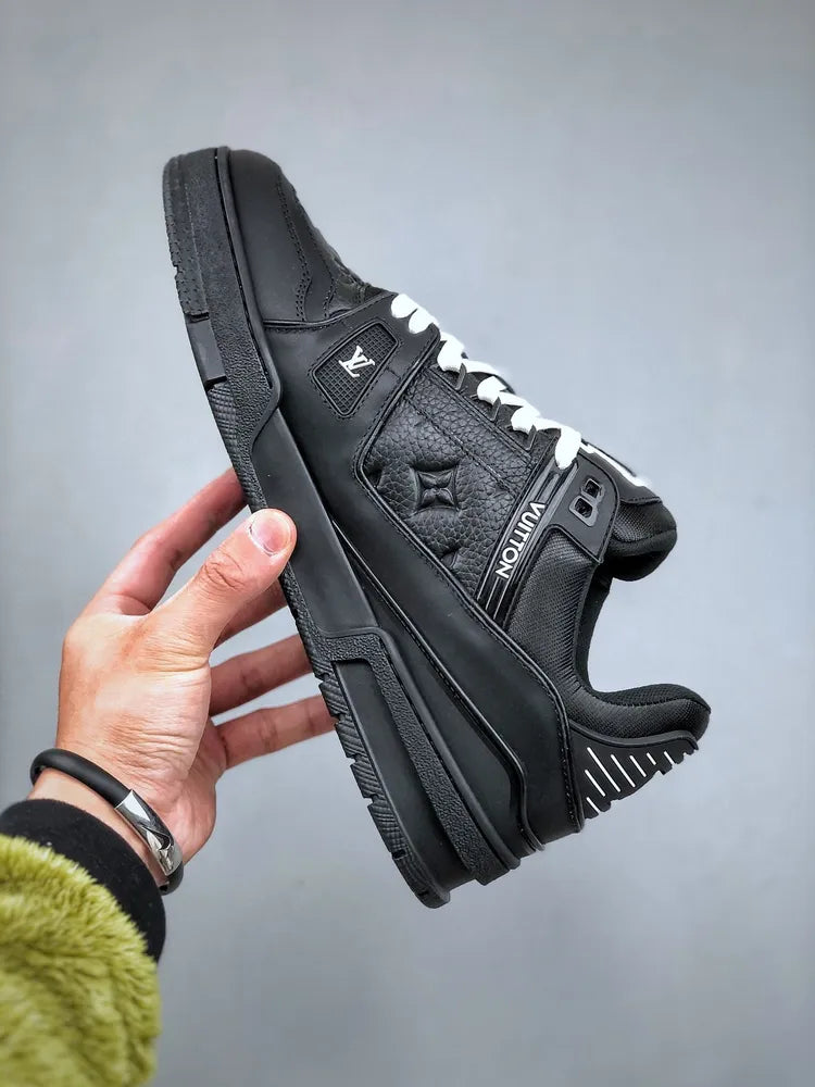 https://cdn.shopify.com/s/files/1/0648/4253/0893/files/LouisVuittonBlackTrainer_6.webp?v=1762887084