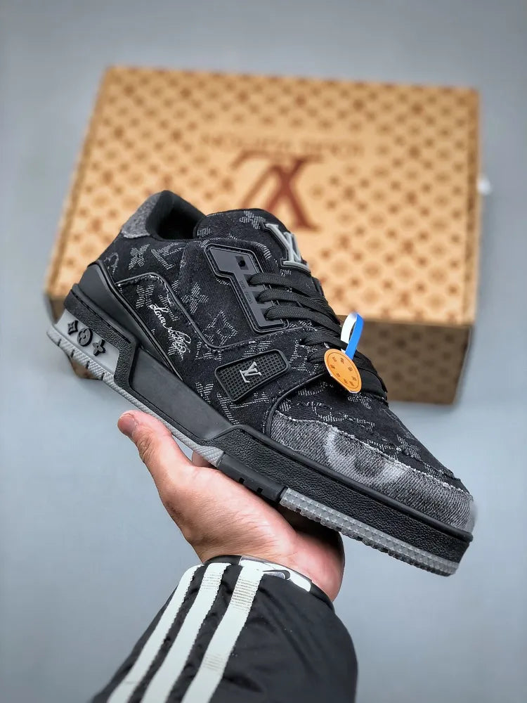 https://cdn.shopify.com/s/files/1/0648/4253/0893/files/LouisVuittonTrainerBlackGreyDenimMonogram_1.webp?v=1762887588