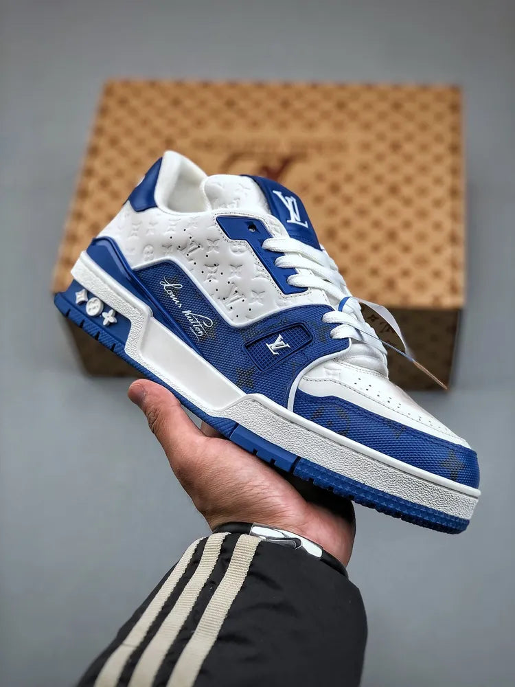 https://cdn.shopify.com/s/files/1/0648/4253/0893/files/LouisVuittonTrainer_54SignatureBlueWhite_1.webp?v=1762887083