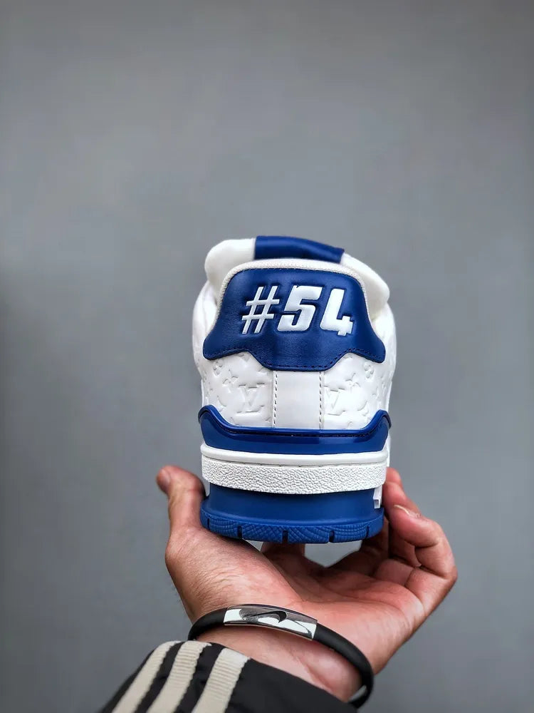https://cdn.shopify.com/s/files/1/0648/4253/0893/files/LouisVuittonTrainer_54SignatureBlueWhite_3.webp?v=1762887083