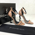 https://cdn.shopify.com/s/files/1/0648/4253/0893/files/SaintLaurentBeigeOpyumSandals_1.jpg?v=1762887551