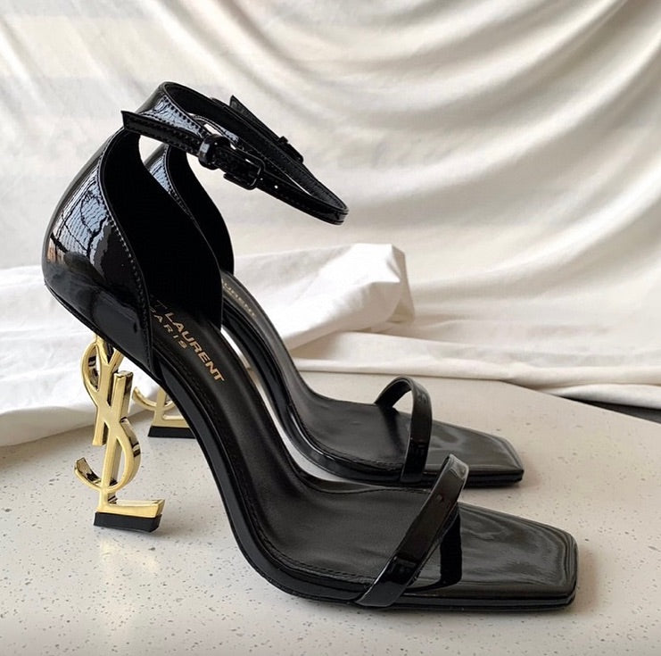 https://cdn.shopify.com/s/files/1/0648/4253/0893/files/SaintLaurentOpyumSandals_3.jpg?v=1762887530