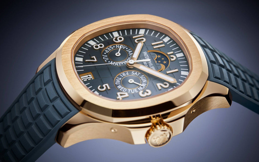 https://cdn.shopify.com/s/files/1/1016/2169/4801/files/dubailuxurywatch-luxury-watches-default-title-patek-philippe-aquanaut-5261r-001-rose-gold-moon-phase-annual-calendar-47468691030291.jpg?v=1770280434
