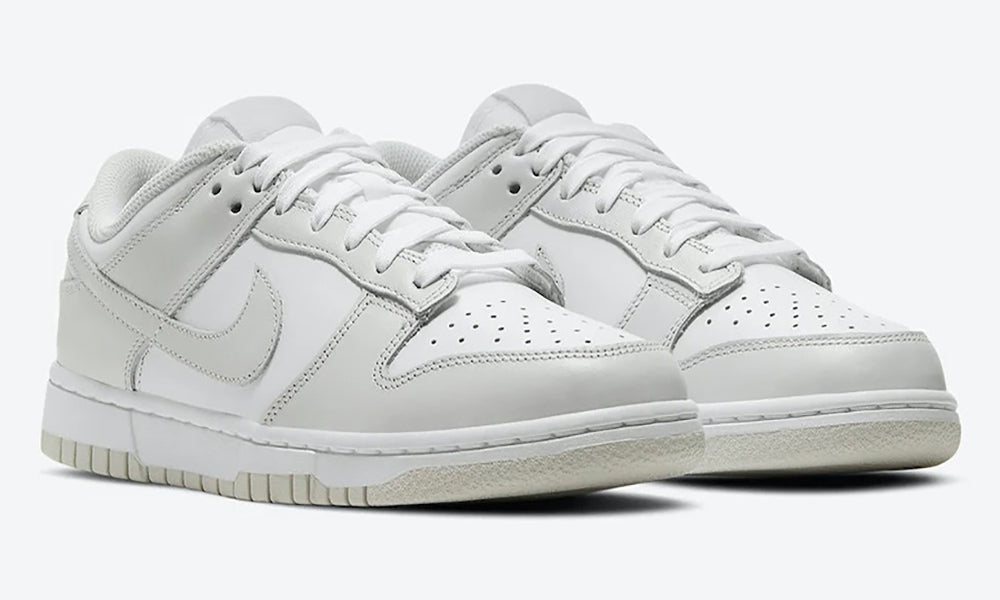 https://cdn.shopify.com/s/files/1/0560/7754/9738/products/nike-dunk-low-photon-dust-womens.jpg?v=1628523371